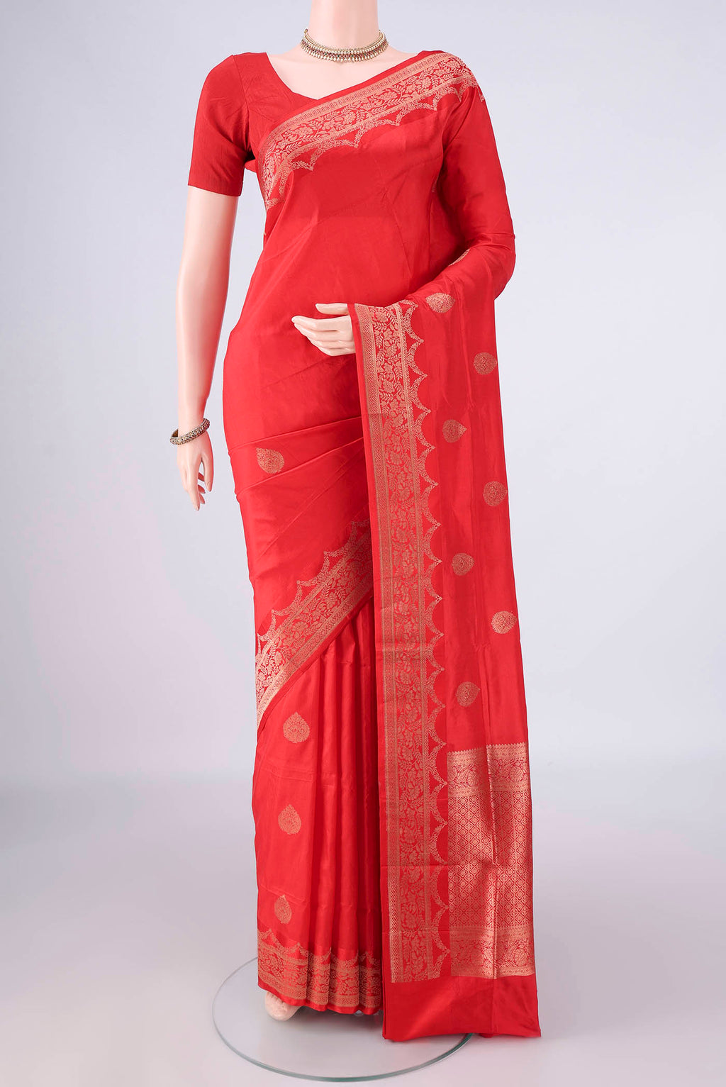 Pure Silk Imperial Red Banarasi Katan Saree with Zari Butta on the body and Zari Border.  displayed on a mannequin