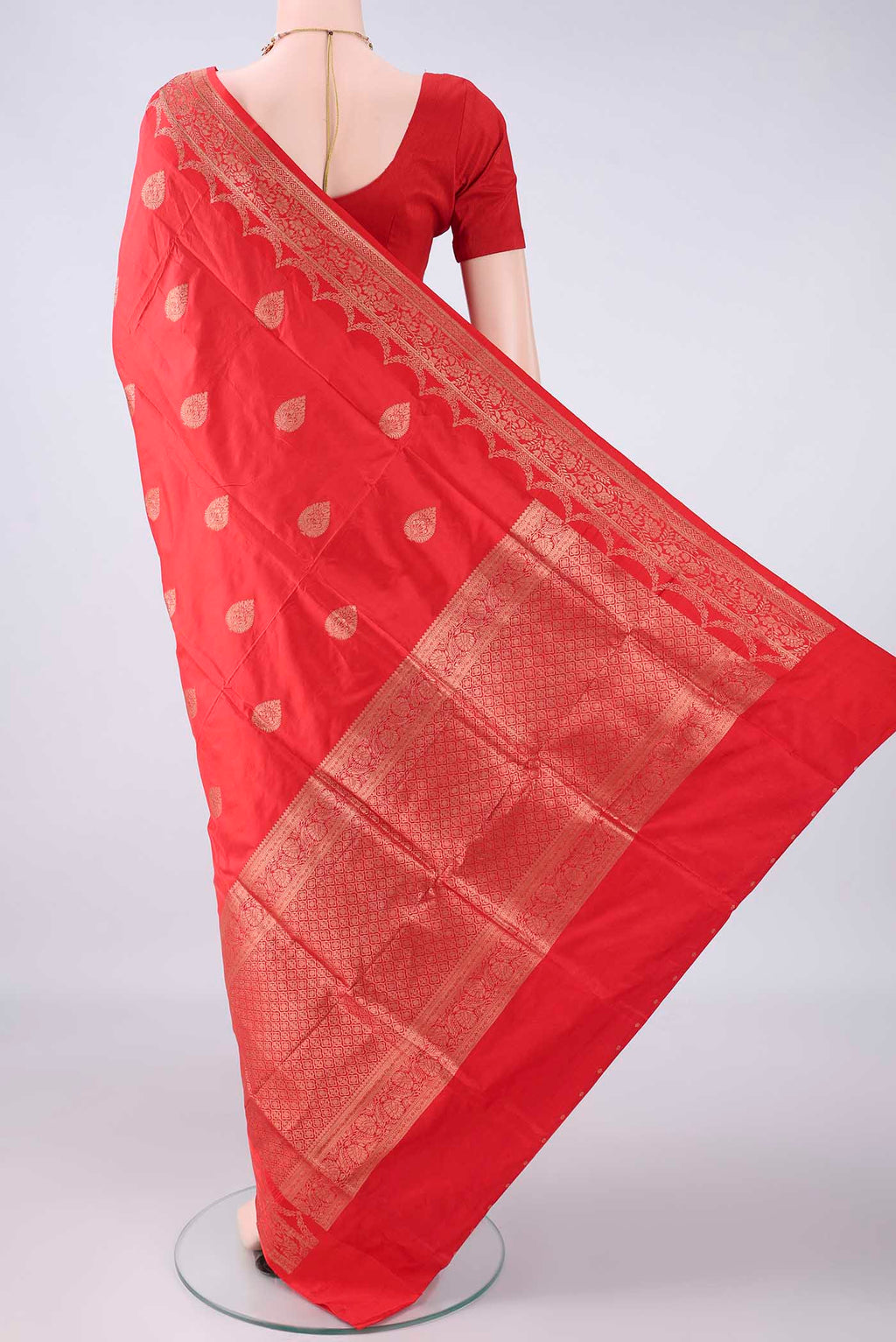 Flat view of Pure Silk Imperial Red Banarasi Katan Saree with Zari Butta on the body and Zari Border. 