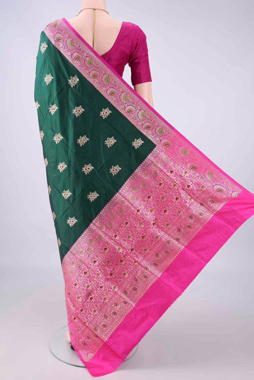 Flat view of Pure Silk Bottle Green Banarasi Katan Saree with Zari And Thread Butta on the body and Zari Border. 