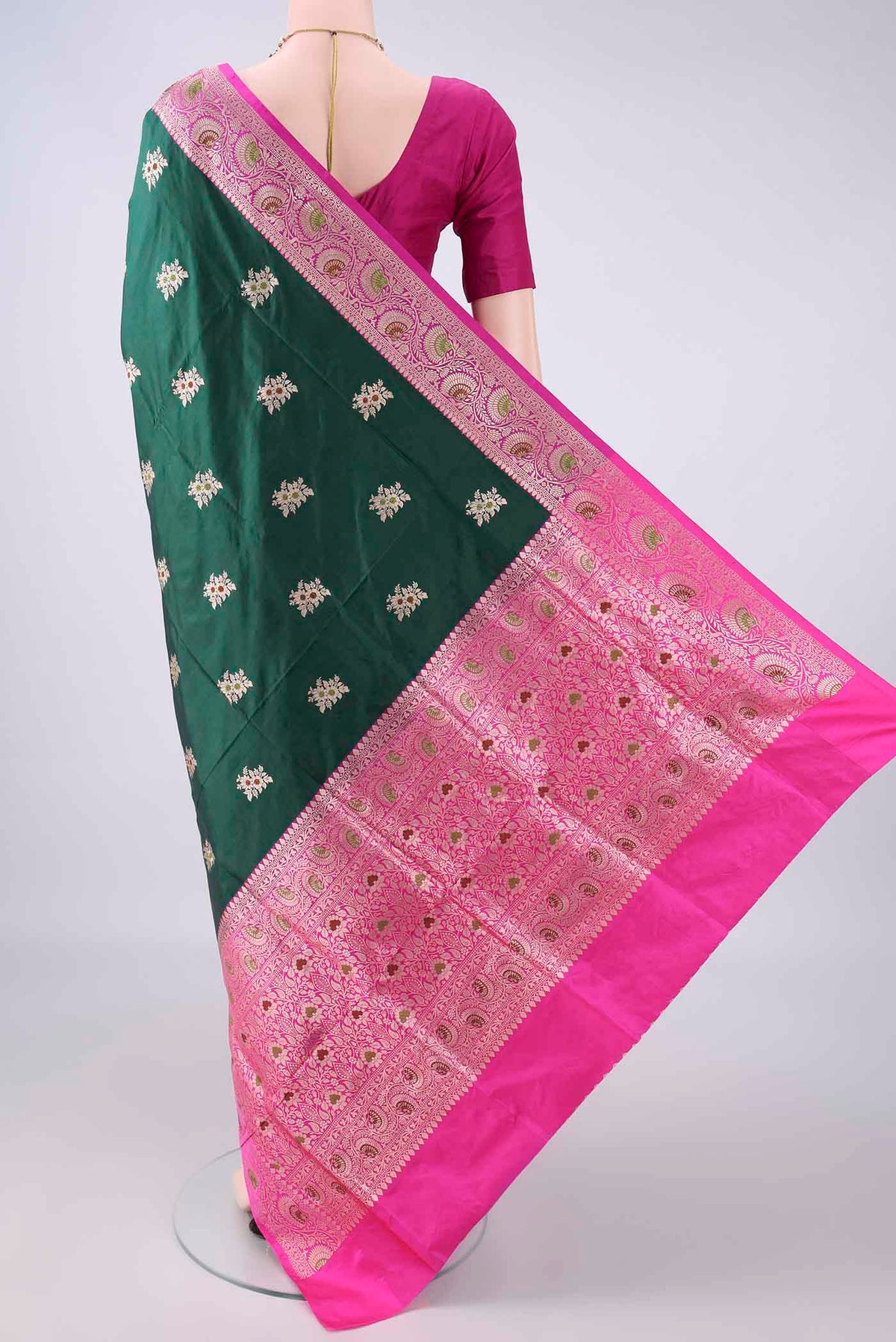 Flat view of Pure Silk Bottle Green Banarasi Katan Saree with Zari And Thread Butta on the body and Zari Border. 