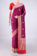 Pure Silk Magenta Banarasi Katan Saree with Zari And Thread Butta on the body and Zari Border.  displayed on a mannequin