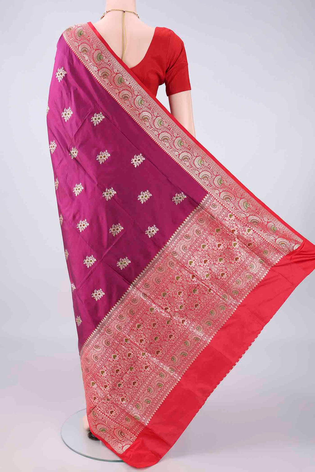 Flat view of Pure Silk Magenta Banarasi Katan Saree with Zari And Thread Butta on the body and Zari Border. 
