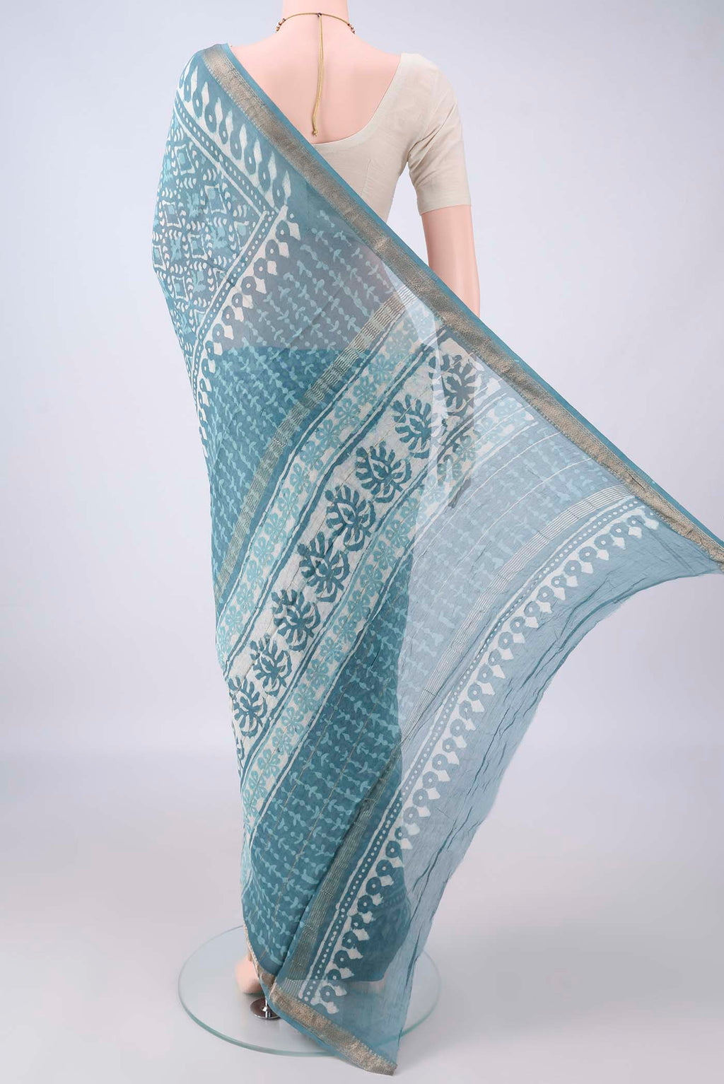 Flat view of Maya Blue Chanderi Cotton Saree with Batik Print on the body and Zari Border. 