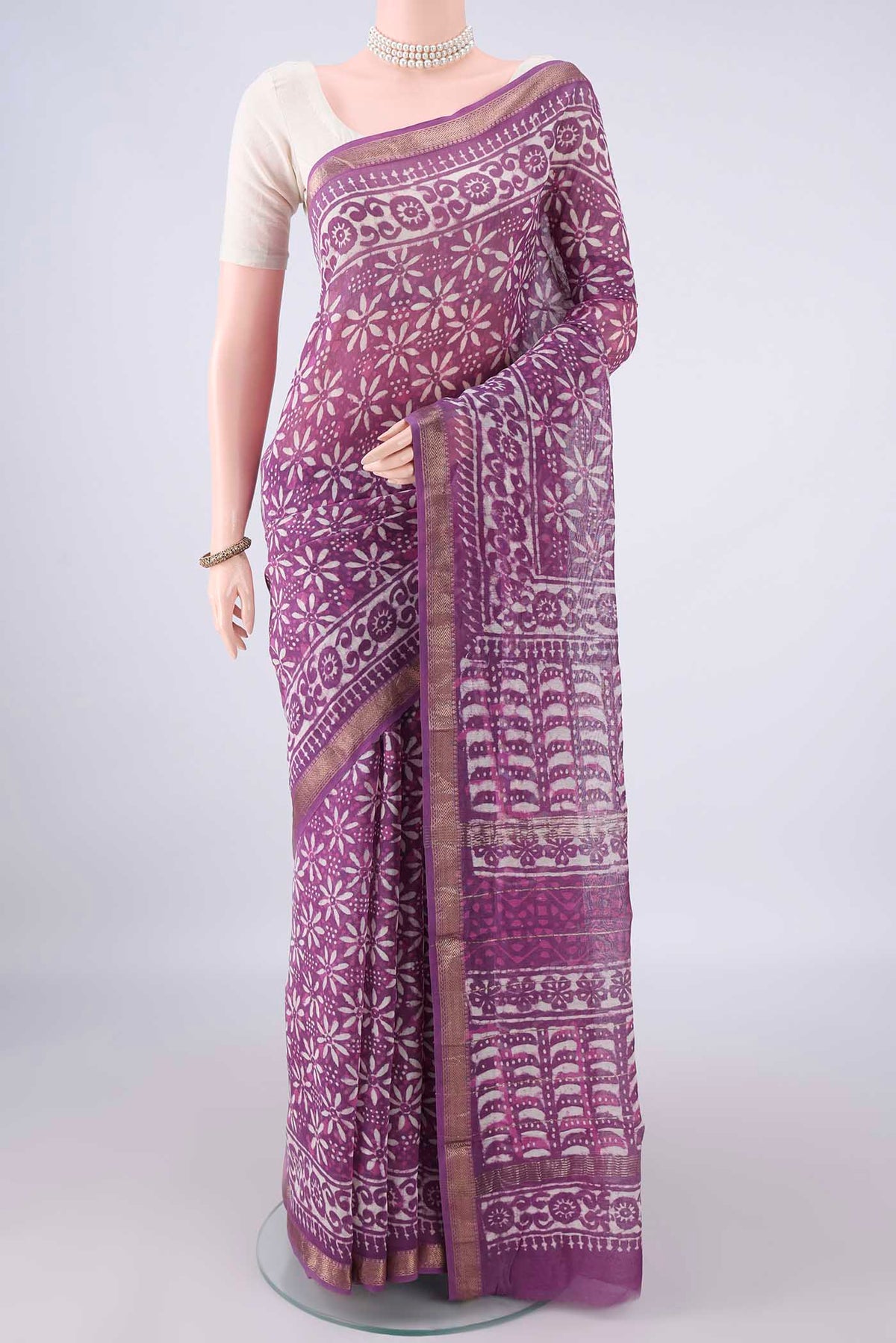 Purple Chanderi Cotton Saree with Batik Print on the body and Zari Border.  displayed on a mannequin