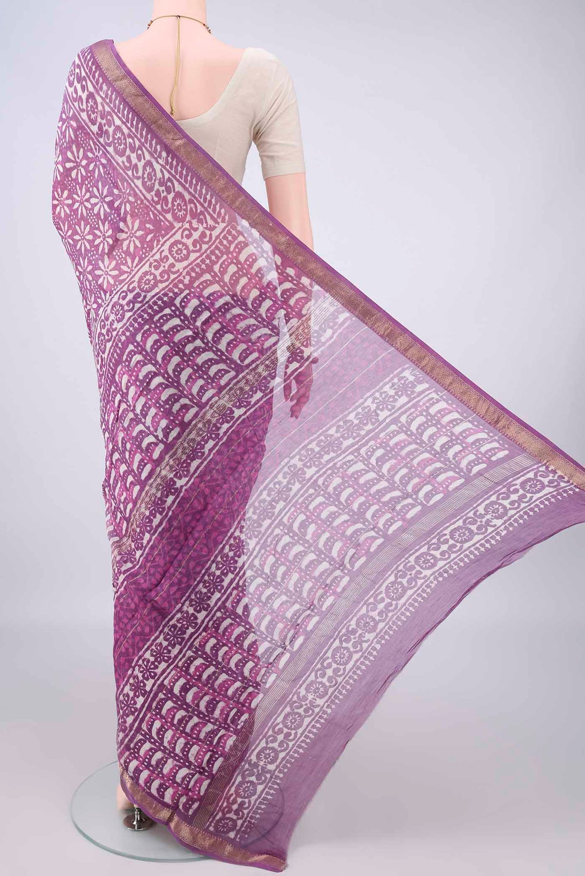 Flat view of Purple Chanderi Cotton Saree with Batik Print on the body and Zari Border. 