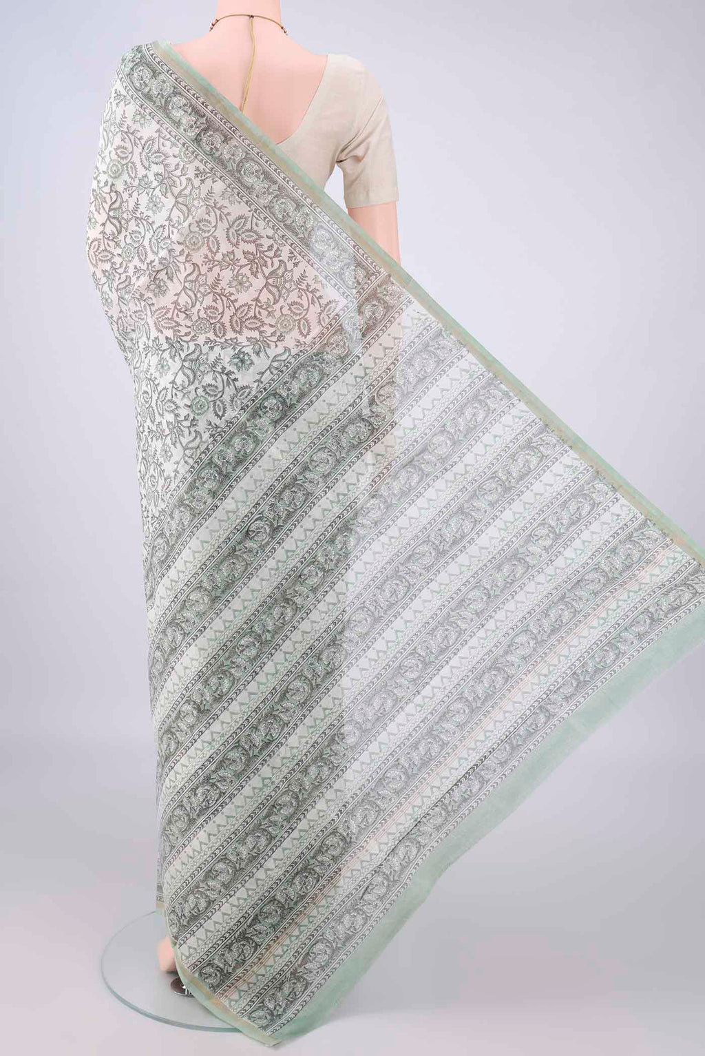 Flat view of White Chanderi Cotton Saree with Printed design on the body and Thin Zari Line. 