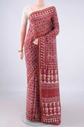Coral Chanderi Cotton Saree with Batik Print on the body and Thin Zari Line.  displayed on a mannequin