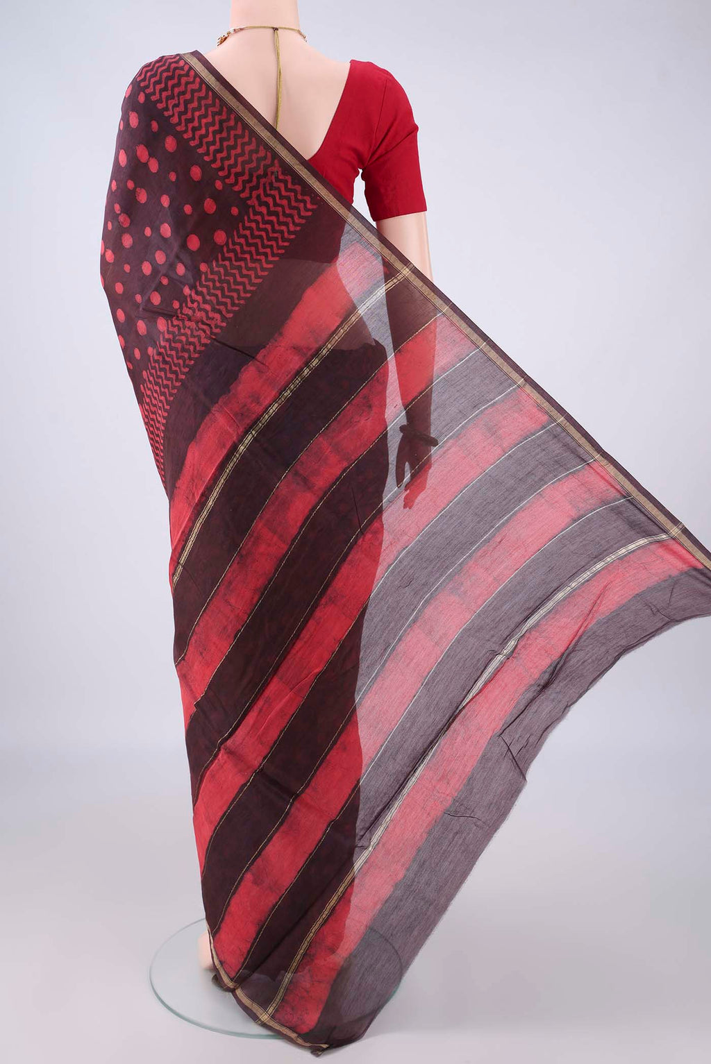 Flat view of Brown Chanderi Cotton Saree with Batik Print on the body and Thin Zari Line. 