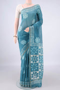 Maya Blue Chanderi Cotton Saree with Batik Print on the body and Thin Zari Line.  displayed on a mannequin