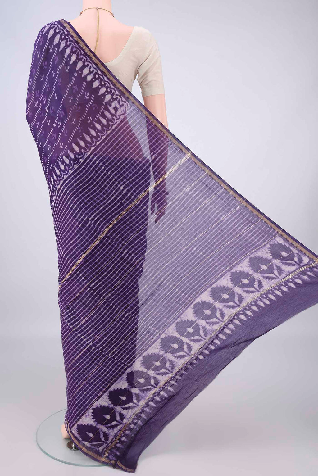Flat view of Purple Chanderi Cotton Saree with Batik Print on the body and Thin Zari Line. 