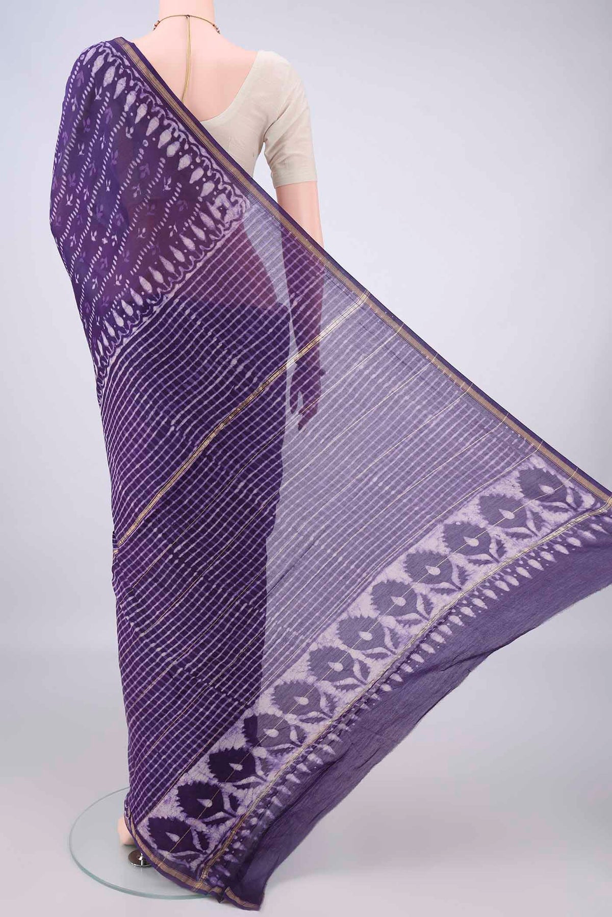 Flat view of Purple Chanderi Cotton Saree with Batik Print on the body and Thin Zari Line. 