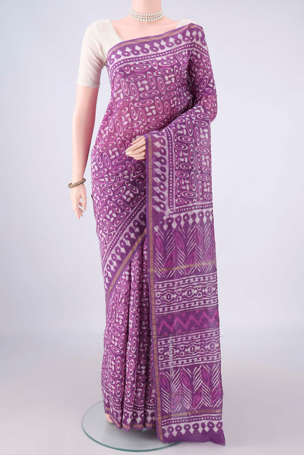 Purple Chanderi Cotton Saree with Batik Print on the body and Thin Zari Line.  displayed on a mannequin