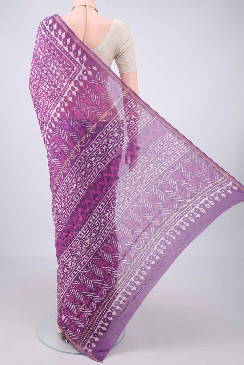 Flat view of Purple Chanderi Cotton Saree with Batik Print on the body and Thin Zari Line. 