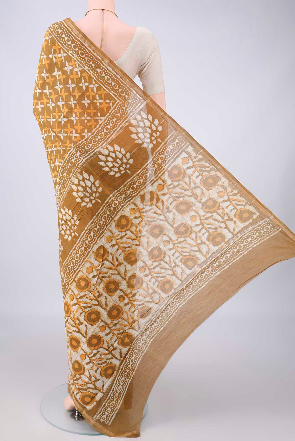 Flat view of Mustard Chanderi Cotton Saree with Batik Print on the body and Thin Zari Line. 