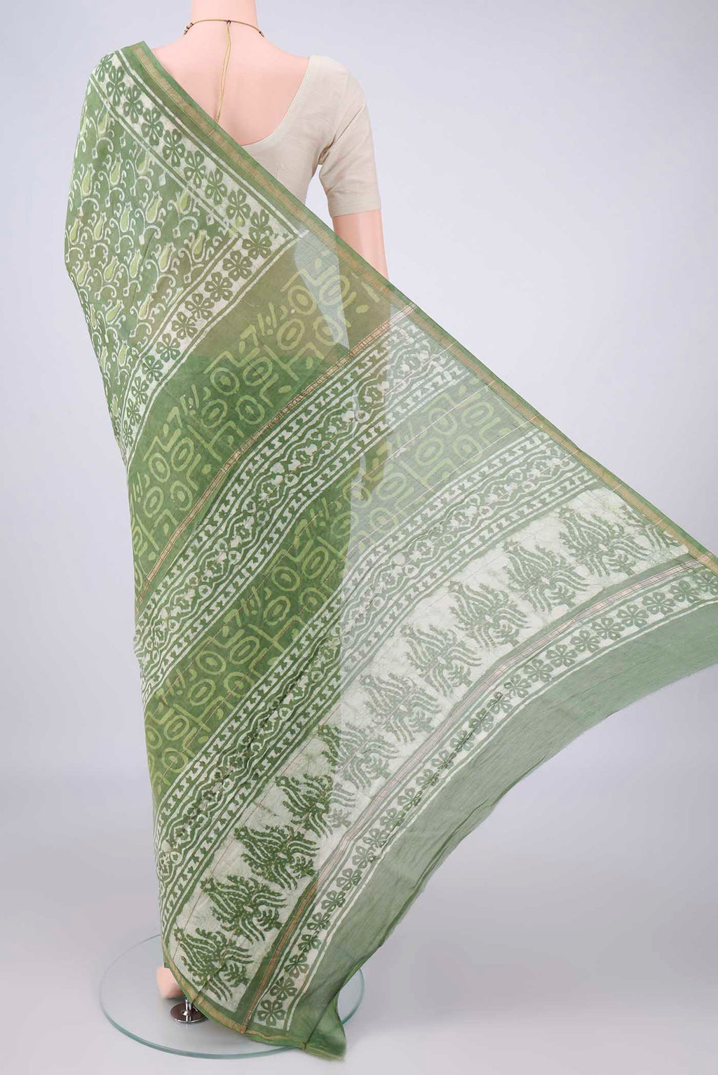 Flat view of Light Green Chanderi Cotton Saree with Batik Print on the body and Thin Zari Line. 