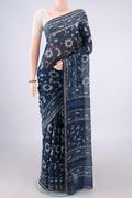 Indigo Chanderi Cotton Saree with Batik Print on the body and Thin Zari Line.  displayed on a mannequin