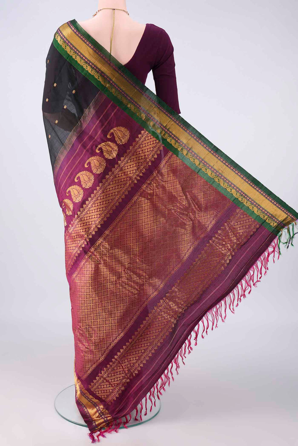 Flat view of Black Gadwal Cotton Saree with Thread Butta on the body and Zari Border. 