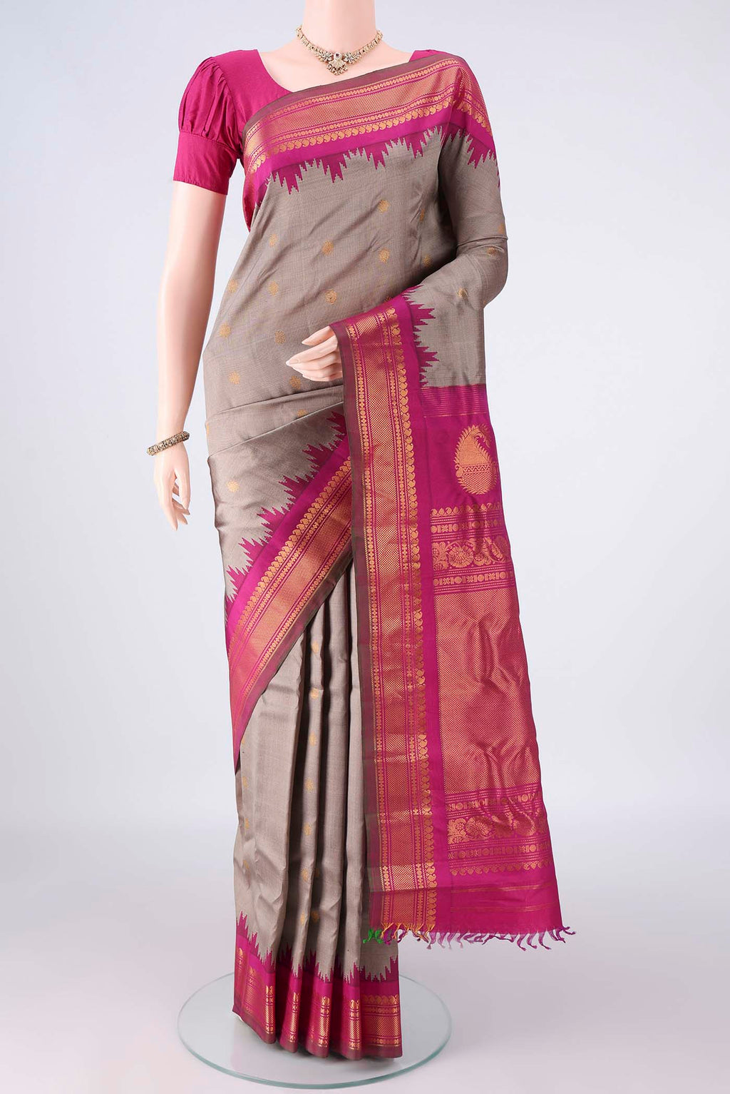 Pure Silk Grey Gadwal Saree with Zari Butta on the body and Zari Border.  displayed on a mannequin