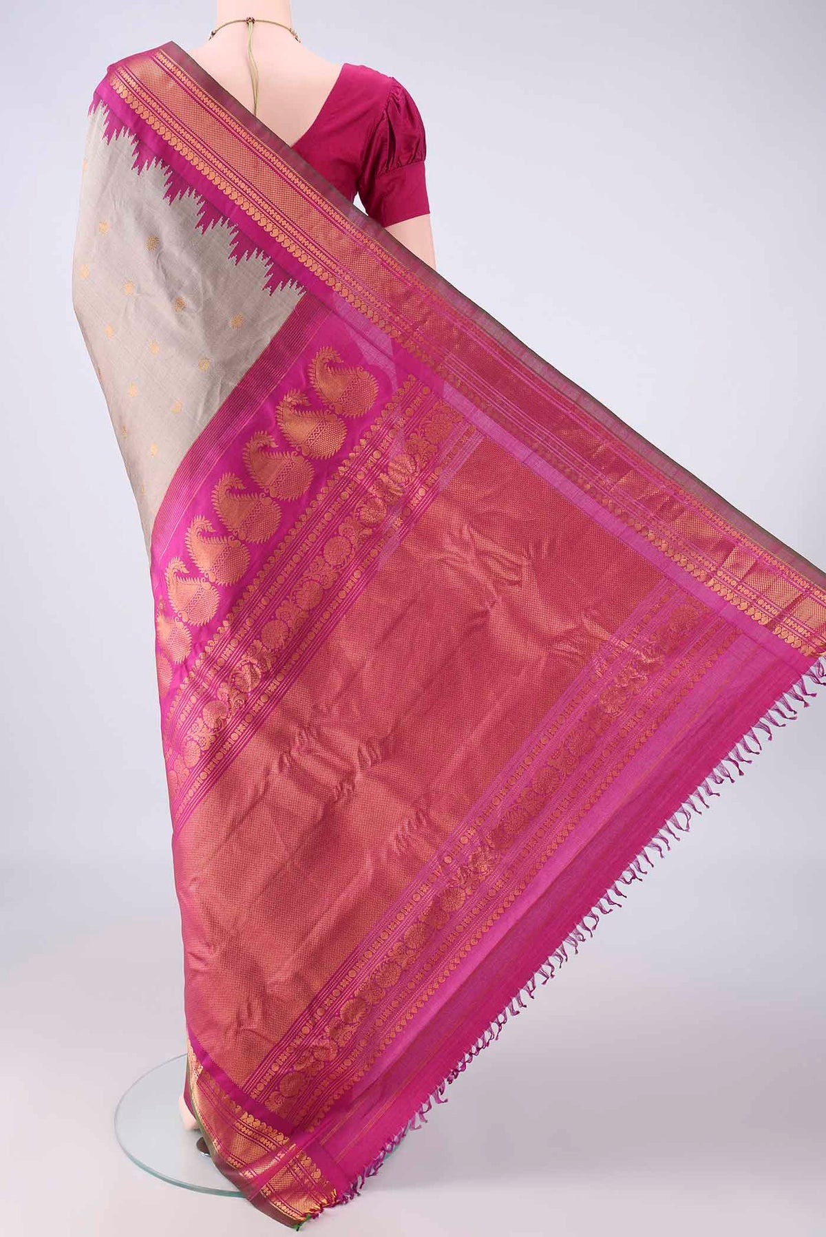 Flat view of Pure Silk Grey Gadwal Saree with Zari Butta on the body and Zari Border. 