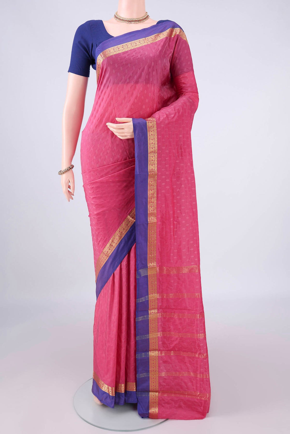 Rose pink Blended Bangalore Silk Saree with Jacquard design on the body and Zari Border.  displayed on a mannequin