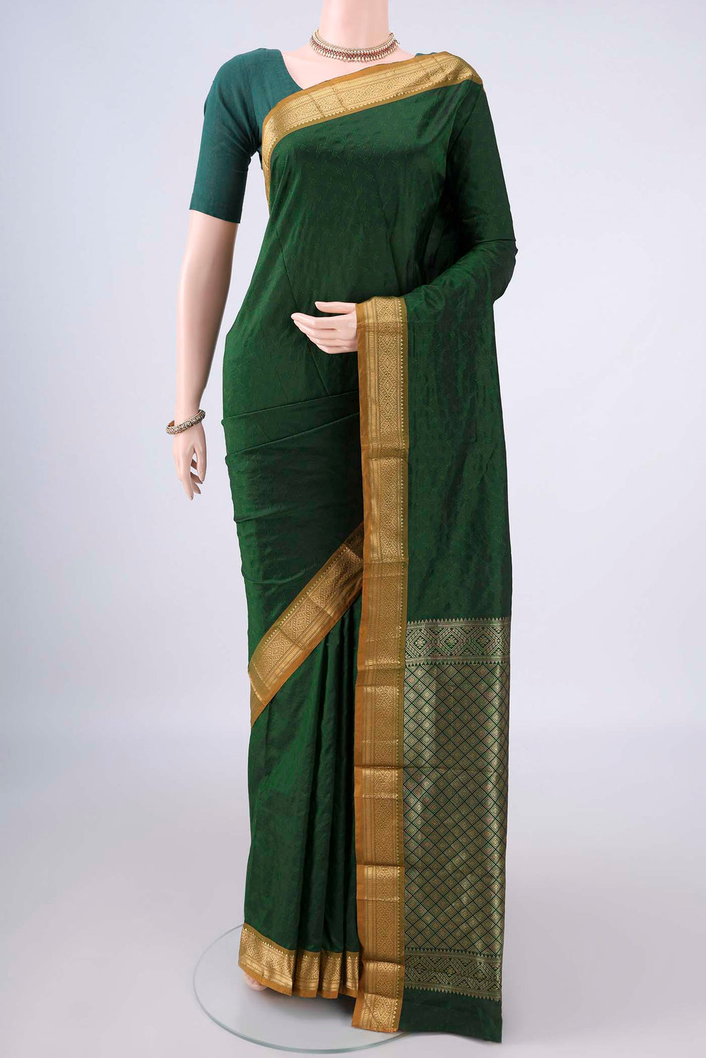 Bottle Green Blended Bangalore Silk Saree with Jacquard design on the body and Zari Border.  displayed on a mannequin