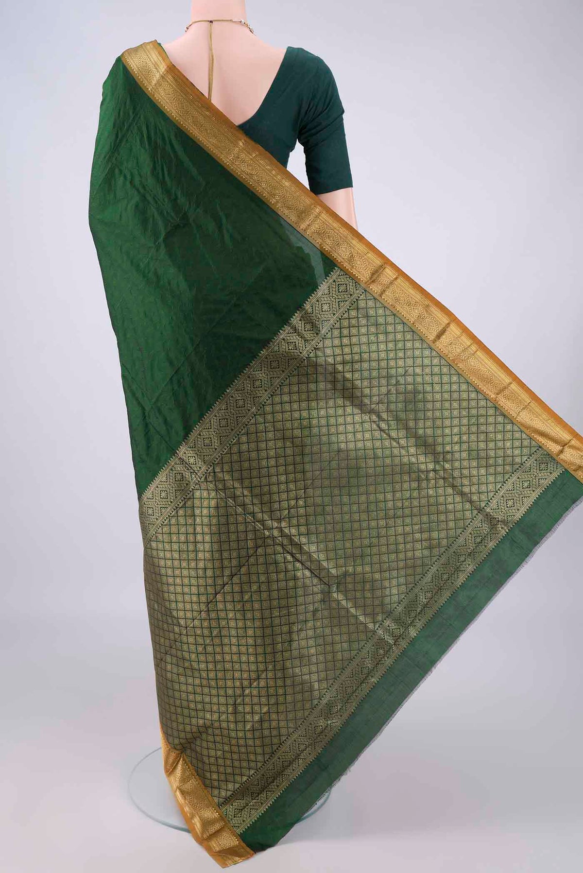 Flat view of Bottle Green Blended Bangalore Silk Saree with Jacquard design on the body and Zari Border. 