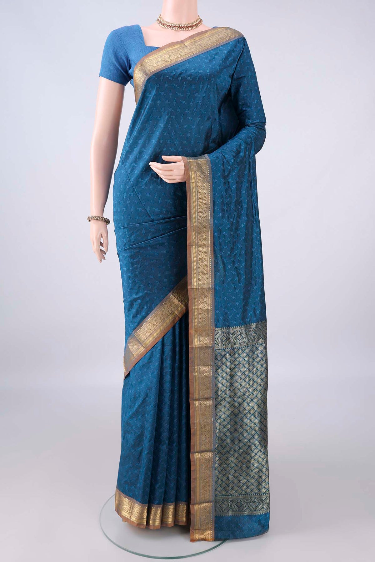 Blue Blended Bangalore Silk Saree with Jacquard design on the body and Zari Border.  displayed on a mannequin