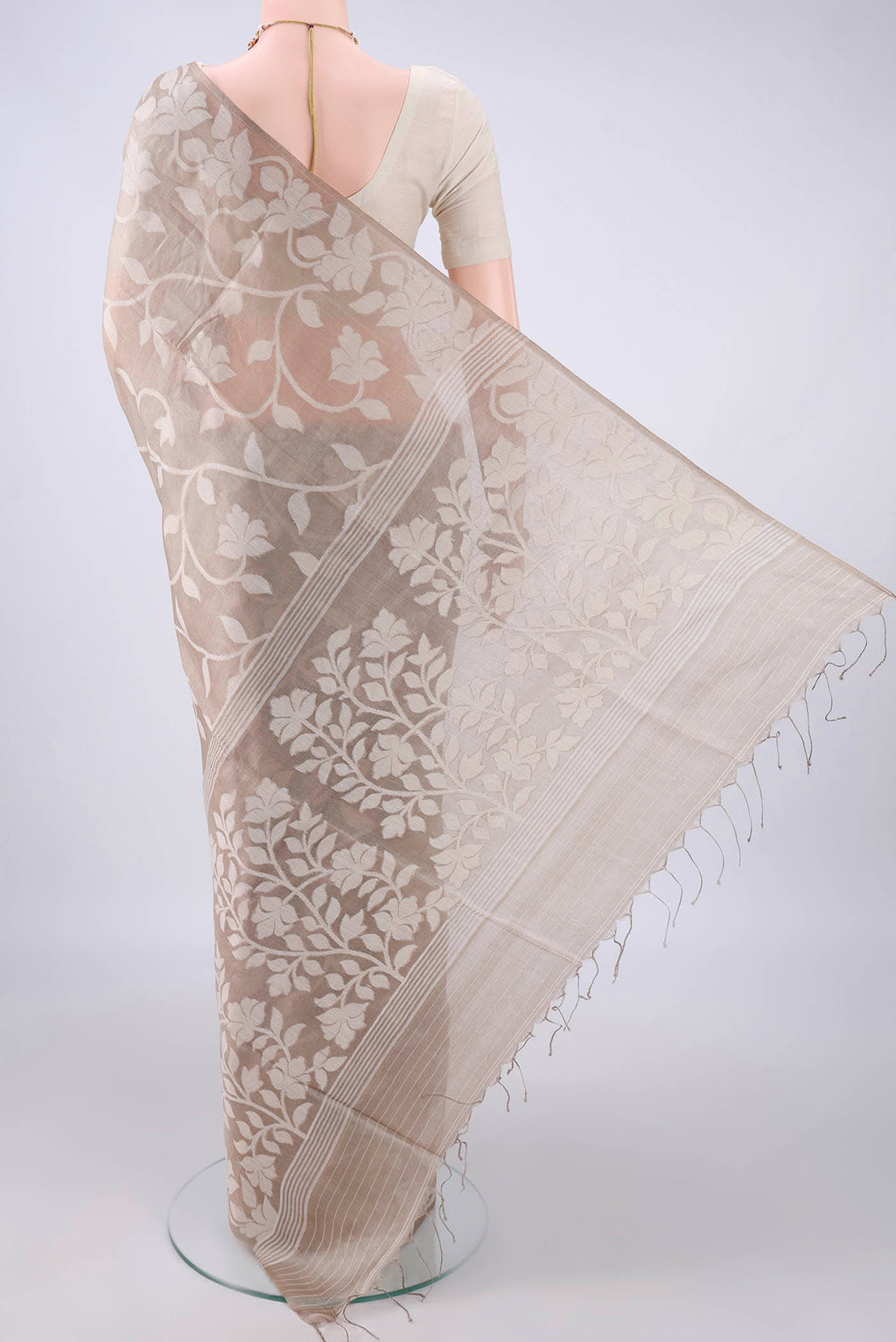 Flat view of Beige Tussar Saree with Thread Brocade on the body and Thread Border. 