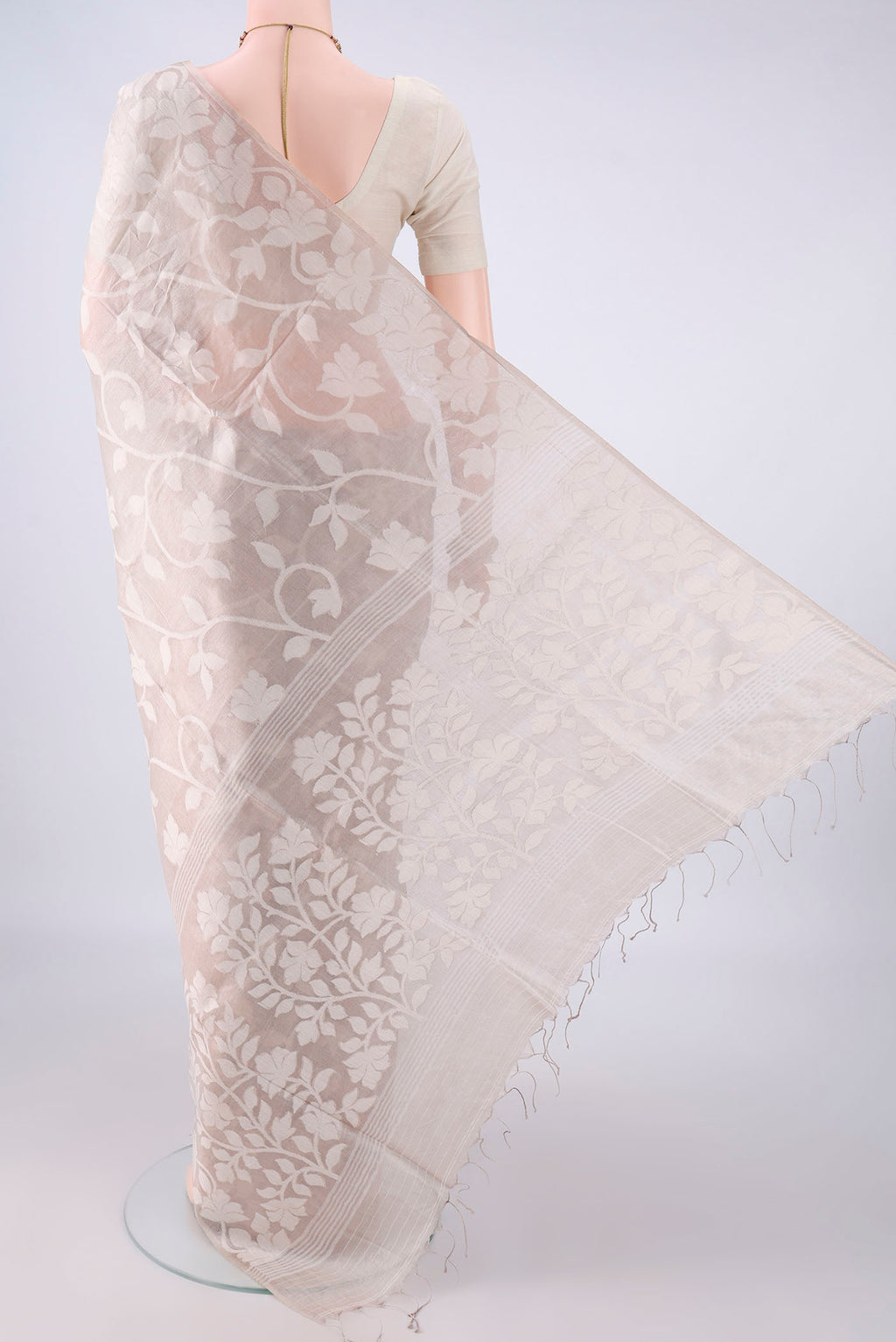 Flat view of Beige Tussar Saree with Jamdani on the body and Thread Border. 