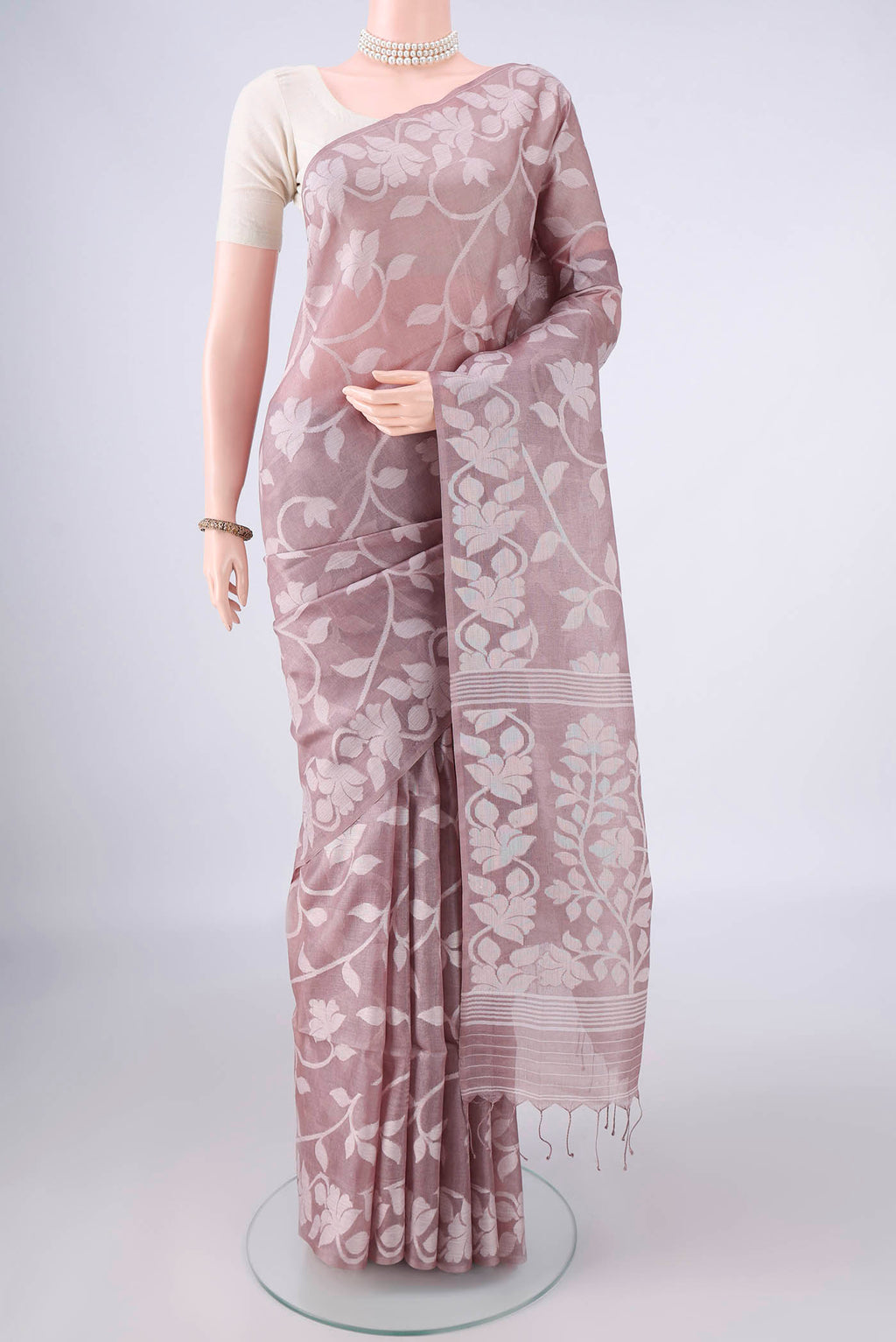 Rose Gold Tussar Saree with Jamdani on the body and Thread Border.  displayed on a mannequin