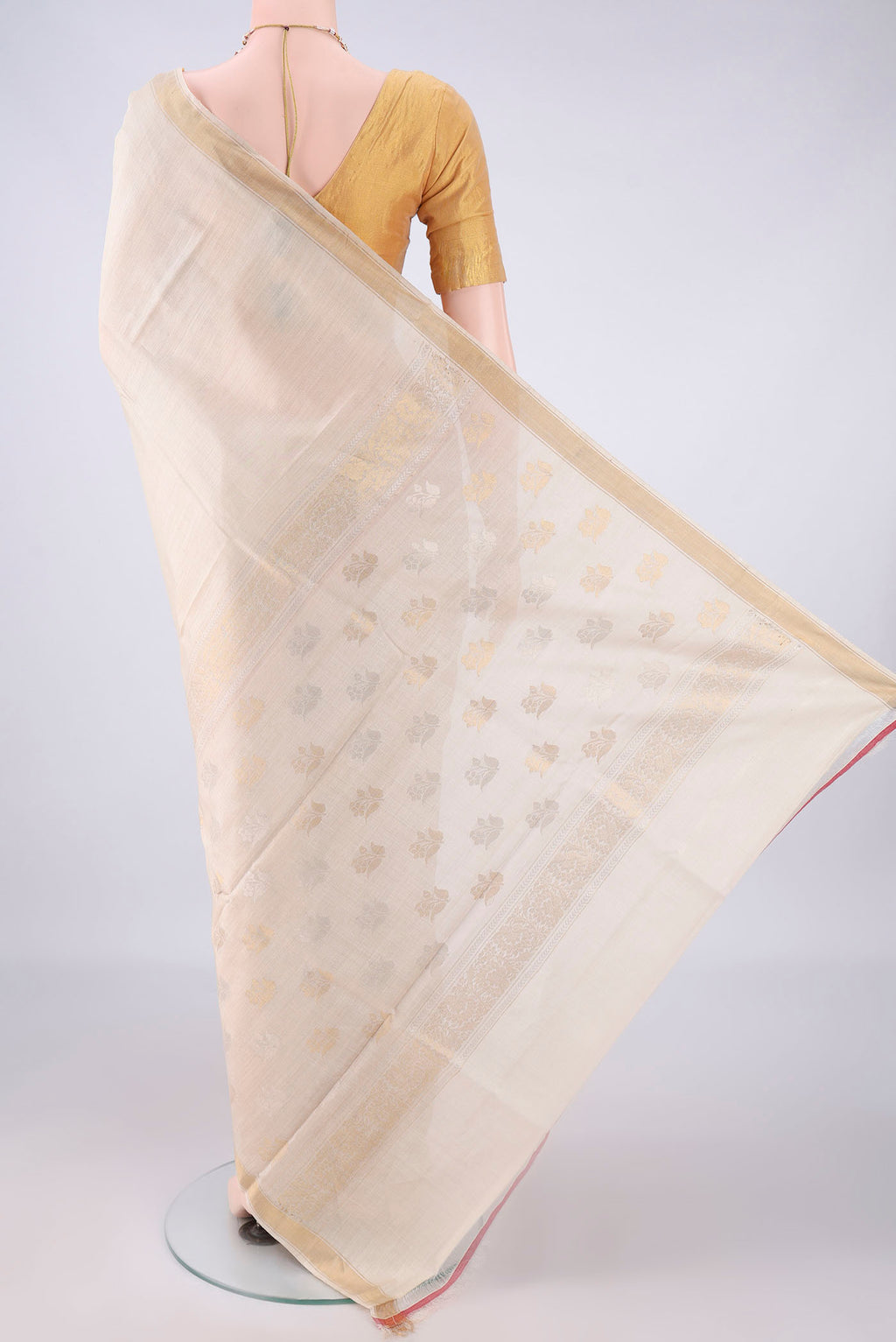 Flat view of Beige Tussar Saree with Plain Body and Zari Border. 