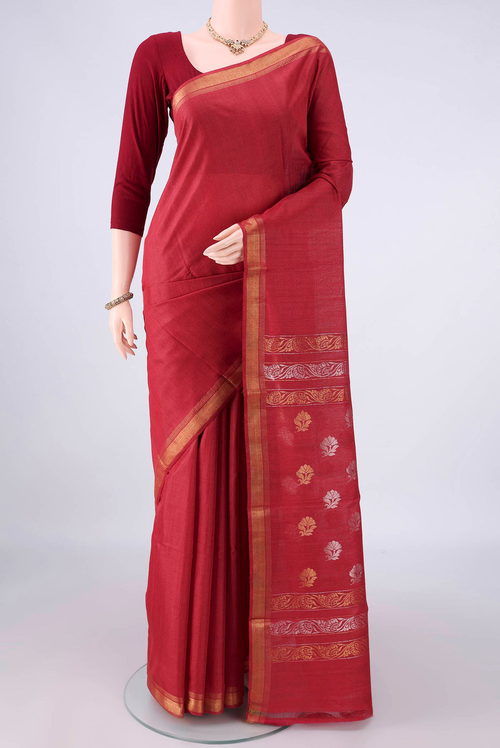 Red Tussar Saree with Plain Body and Zari Border.  displayed on a mannequin