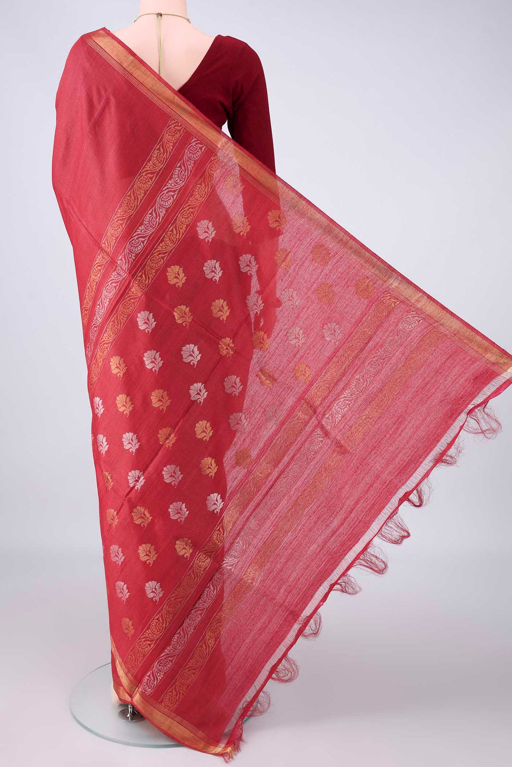 Flat view of Red Tussar Saree with Plain Body and Zari Border. 