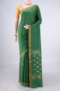 Green Tussar Saree with Plain Body and Zari Border.  displayed on a mannequin