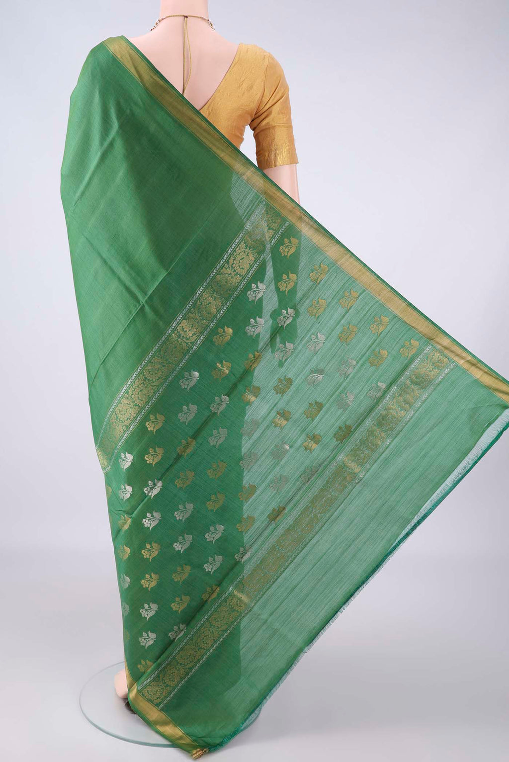 Flat view of Green Tussar Saree with Plain Body and Zari Border. 