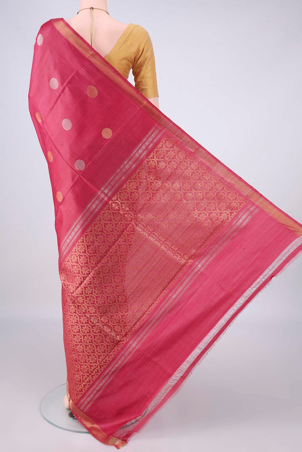 Flat view of Coral MP Tussar Saree with Zari Butta on the body and Zari Border. 