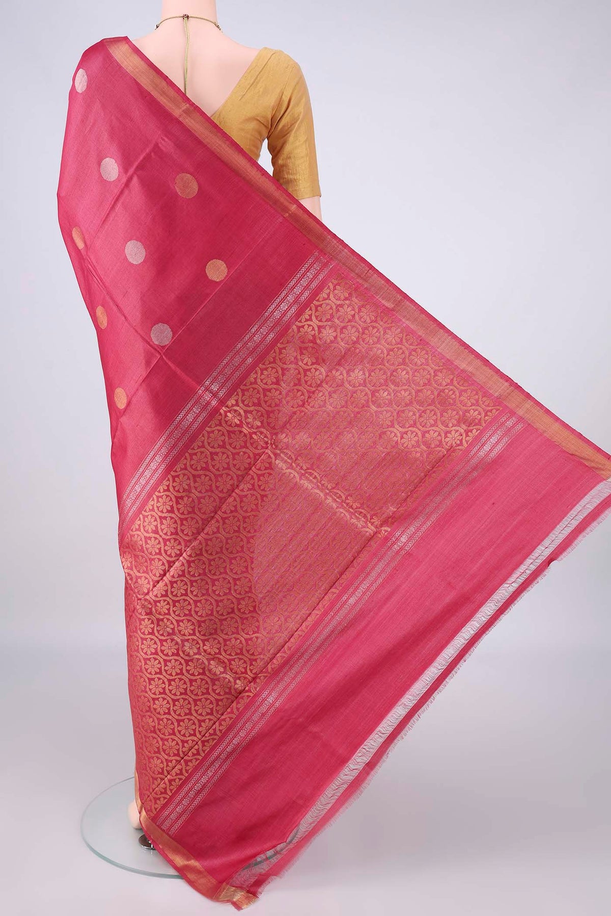Flat view of Coral MP Tussar Saree with Zari Butta on the body and Zari Border. 