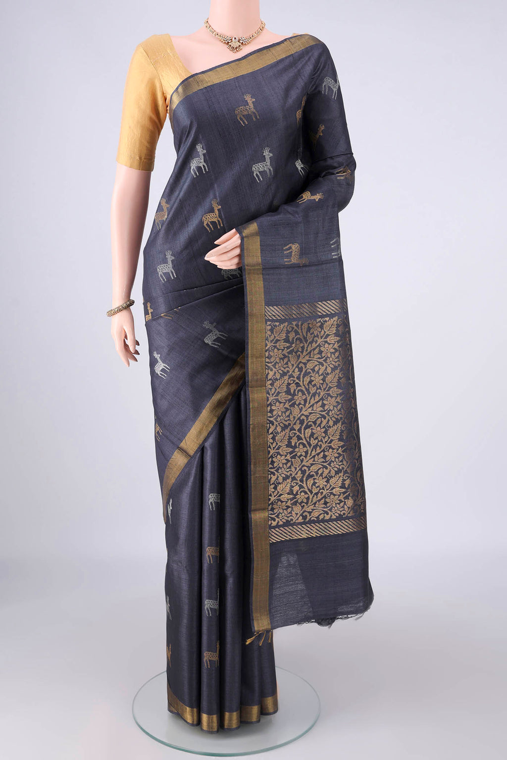 Grey MP Tussar Saree with Zari Butta on the body and Zari Border.  displayed on a mannequin