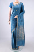 Maya Blue Tussar Saree with Zari Butta on the body and Zari Border.  displayed on a mannequin