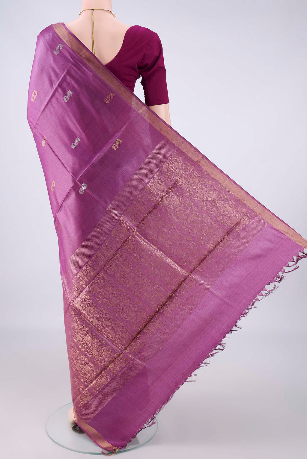 Flat view of Purple MP Tussar Saree with Zari Butta on the body and Zari Border. 