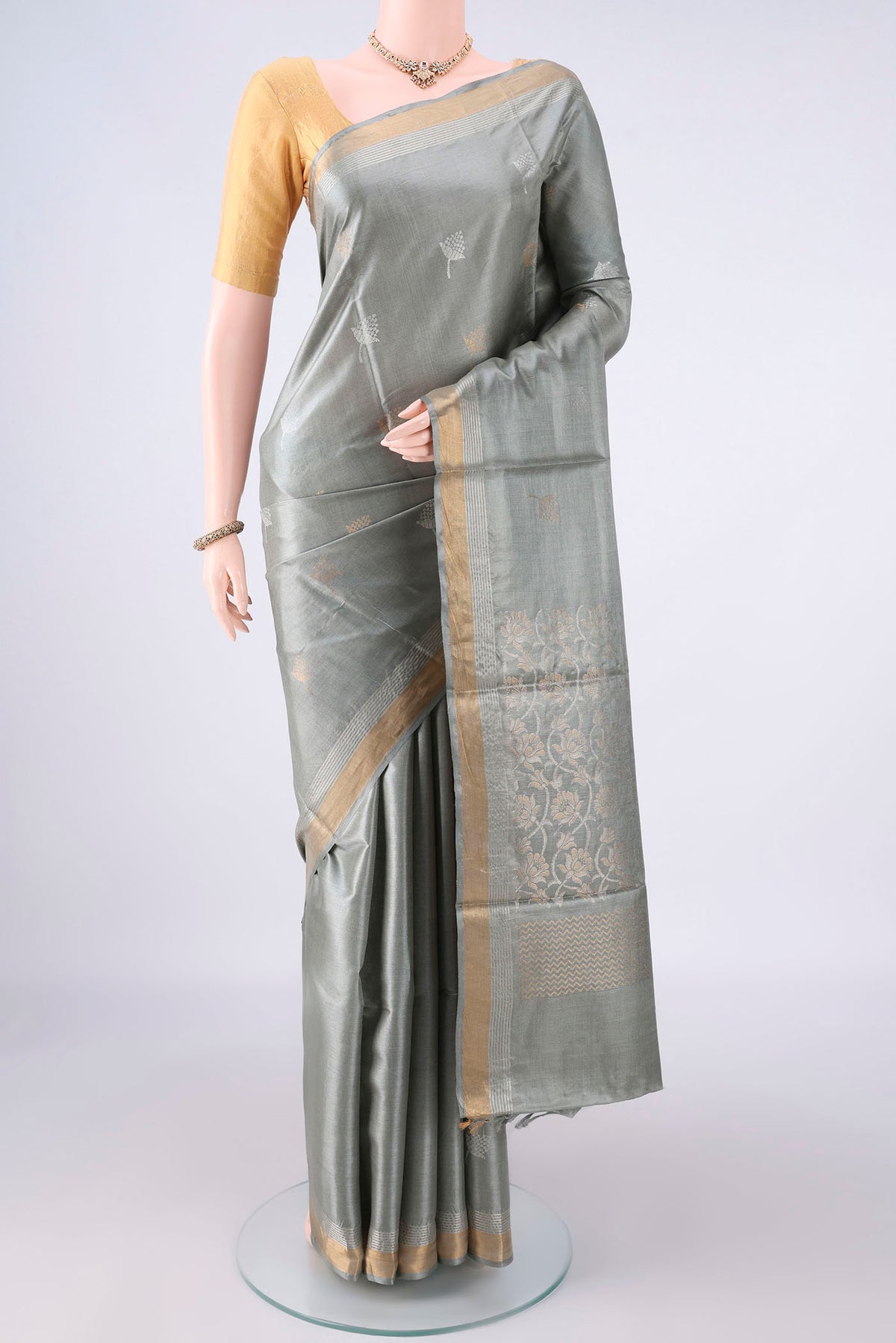 Davys Grey MP Tussar Saree with Zari Butta on the body and Zari Border.  displayed on a mannequin
