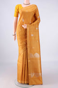 Mustard Tussar Saree with Zari Butta on the body and Zari Border.  displayed on a mannequin