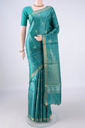 Sea Green Tussar Saree with Zari Butta on the body and Zari Border.  displayed on a mannequin