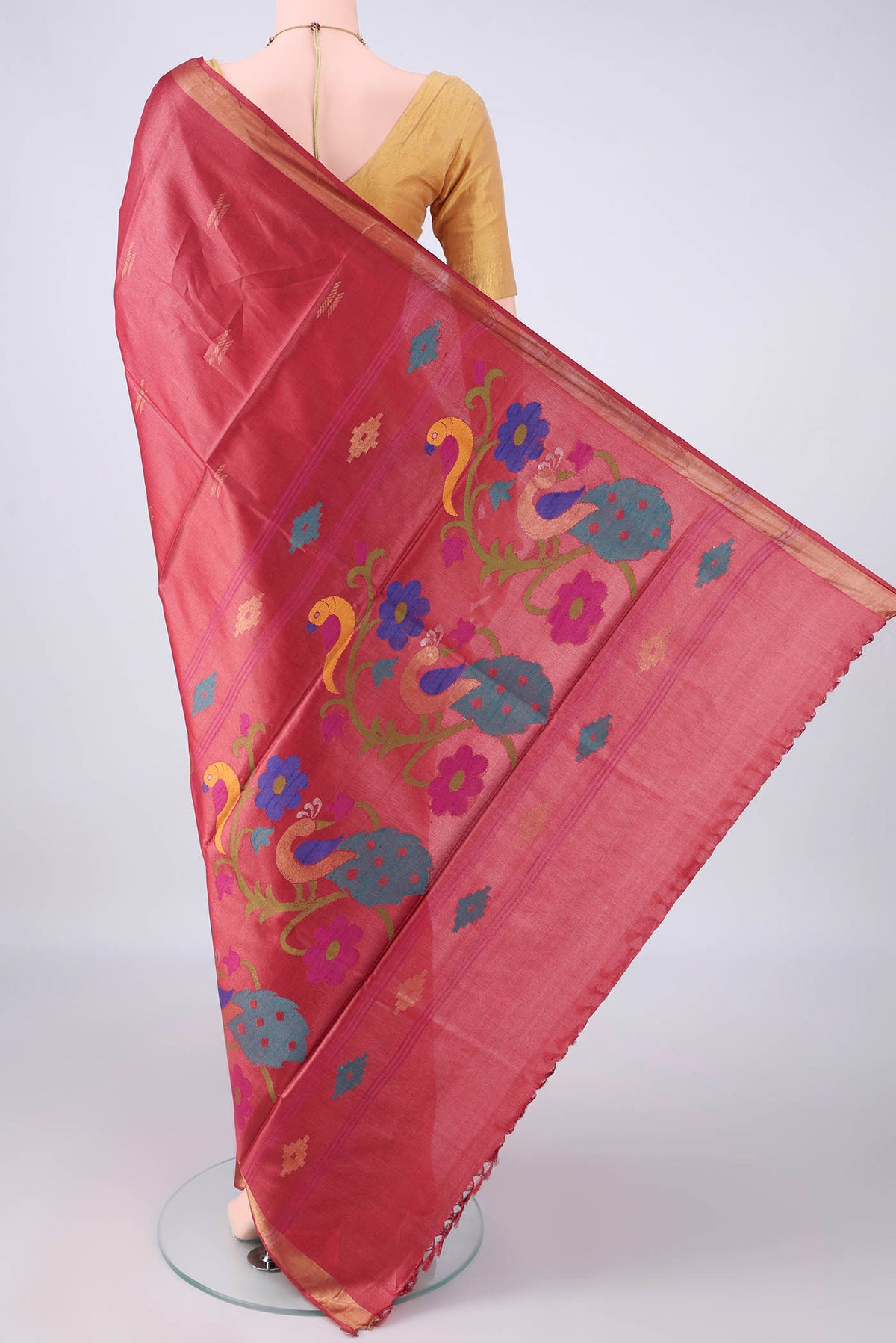 Flat view of Rust MP Tussar Saree with Zari Butta on the body and Zari Border. 
