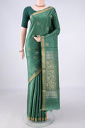Green MP Tussar Saree with Zari Butta on the body and Zari Border.  displayed on a mannequin