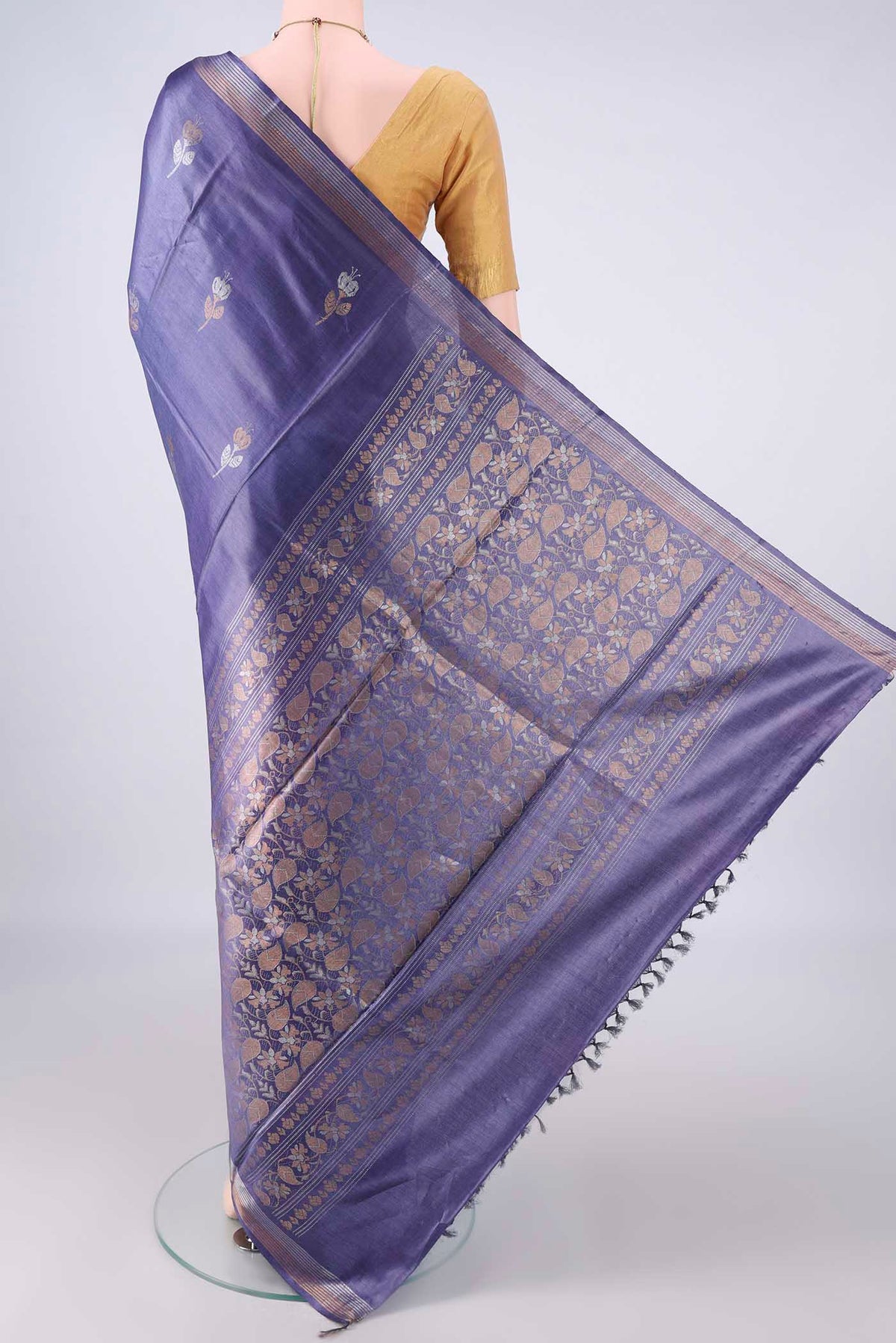 Flat view of Blue Grey MP Tussar Saree with Zari Butta on the body and Zari Border. 