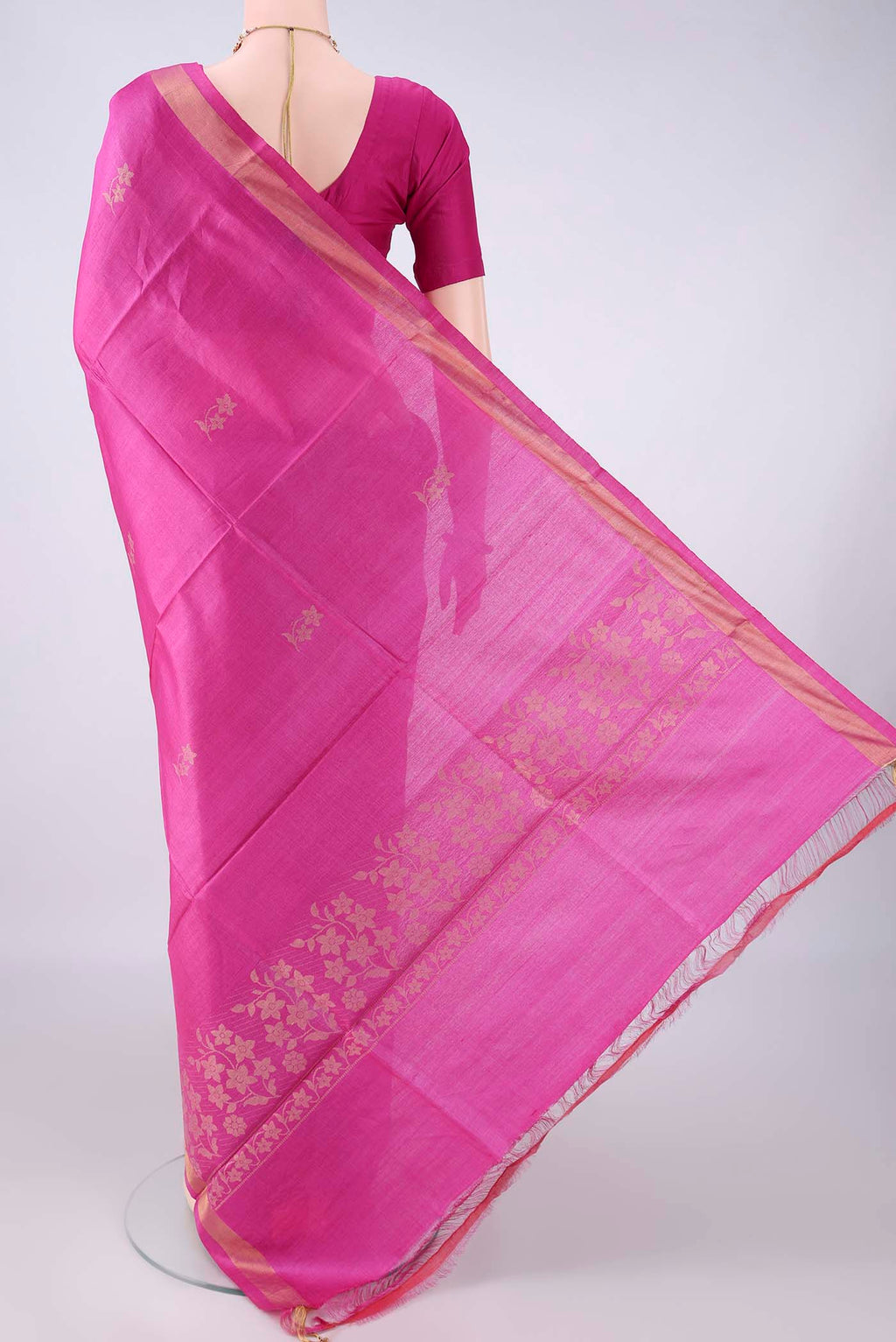 Flat view of Rani Pink MP Tussar Saree with Zari Butta on the body and Zari Border. 