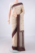 Beige MP Tussar Saree with Thread Butta on the body and Plain Border.  displayed on a mannequin