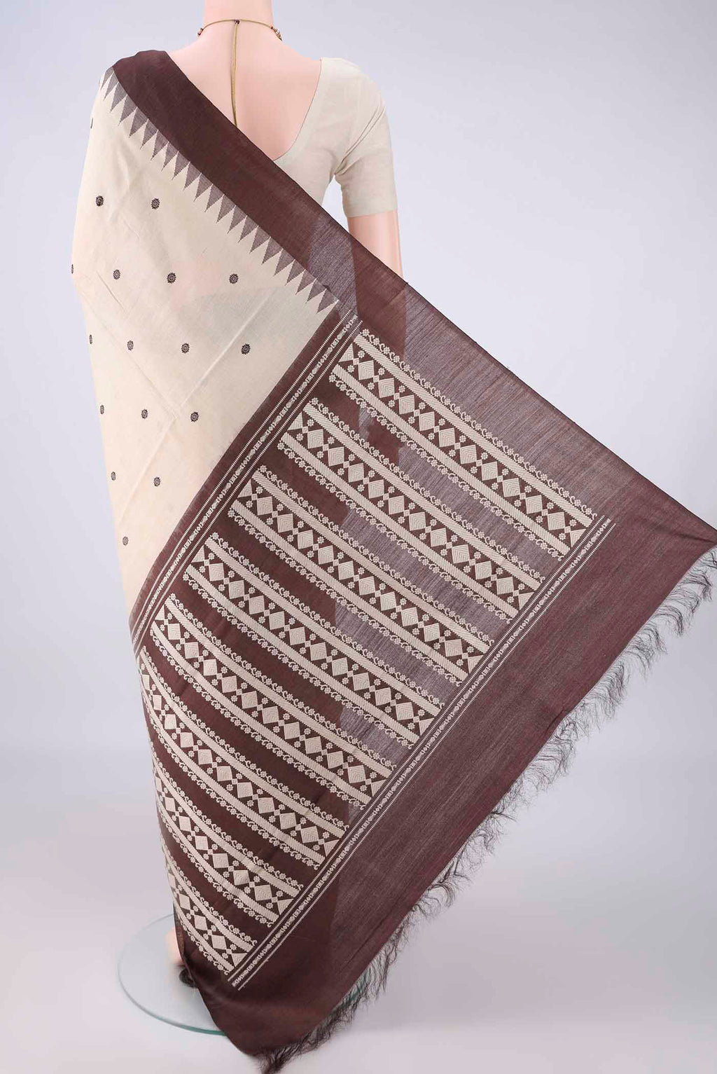 Flat view of Beige MP Tussar Saree with Thread Butta on the body and Plain Border. 