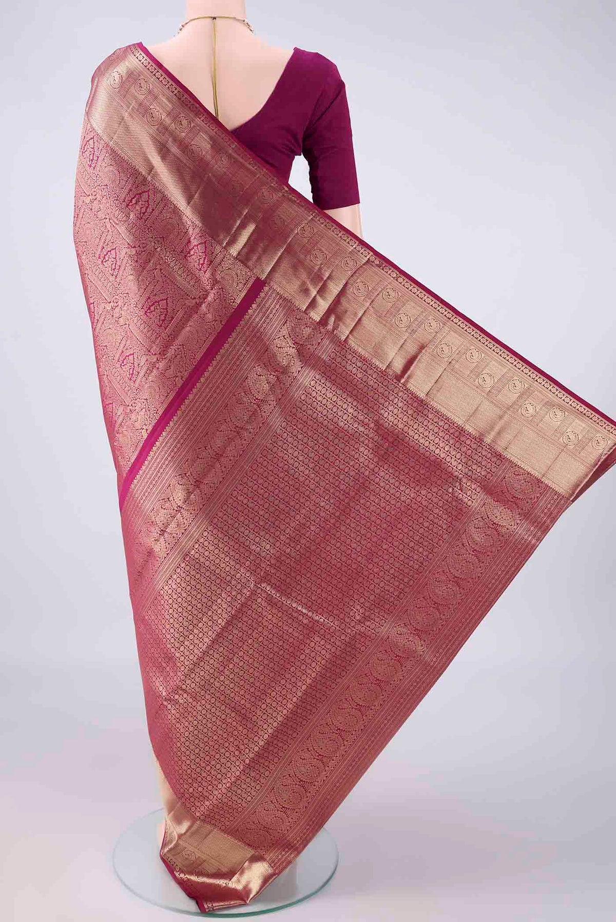 Flat view of Pure Silk Magenta Kanchipuram Saree with Zari Brocade on the body and Zari Border. 